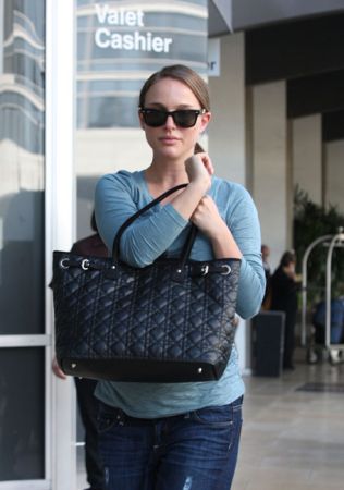 Natalie Portman loves her $4,500 custom Dior purse and so do we